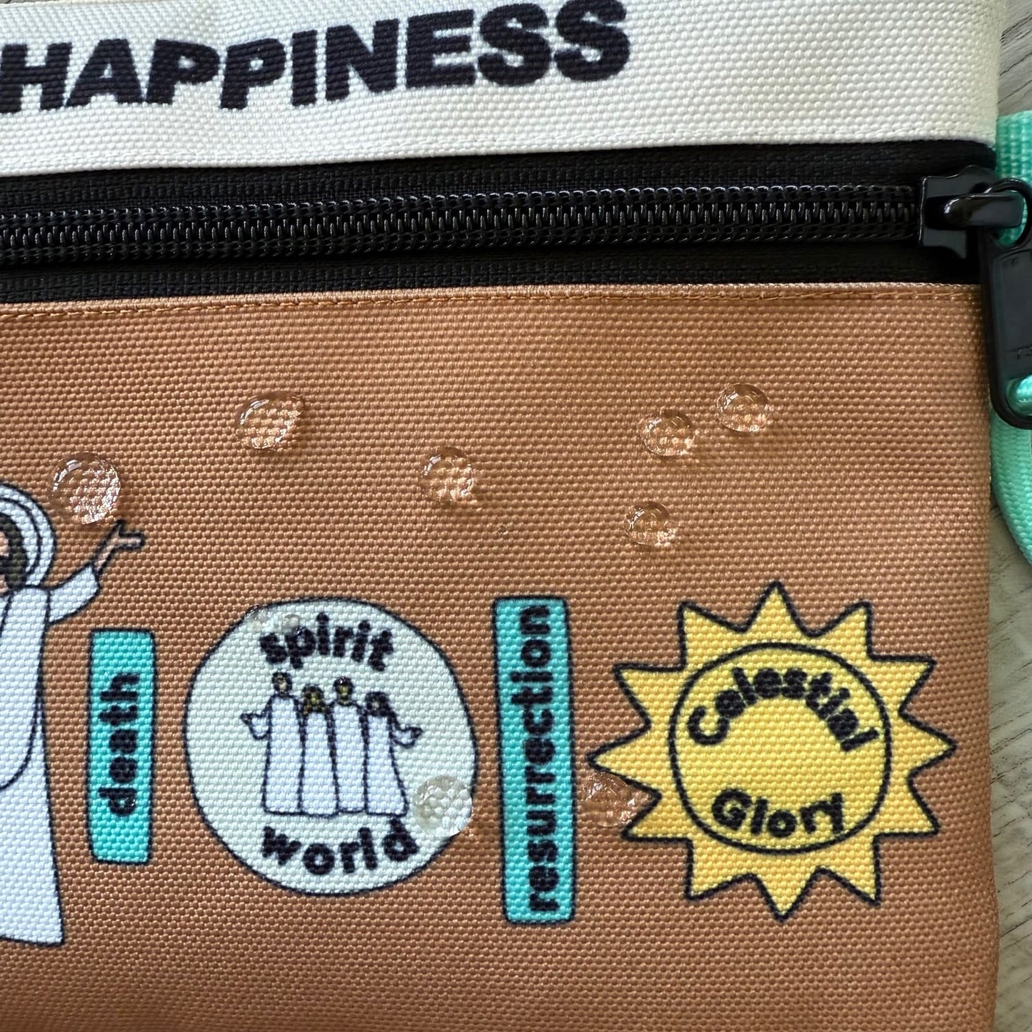 Displaying the water resistant feature of the All In Pouch