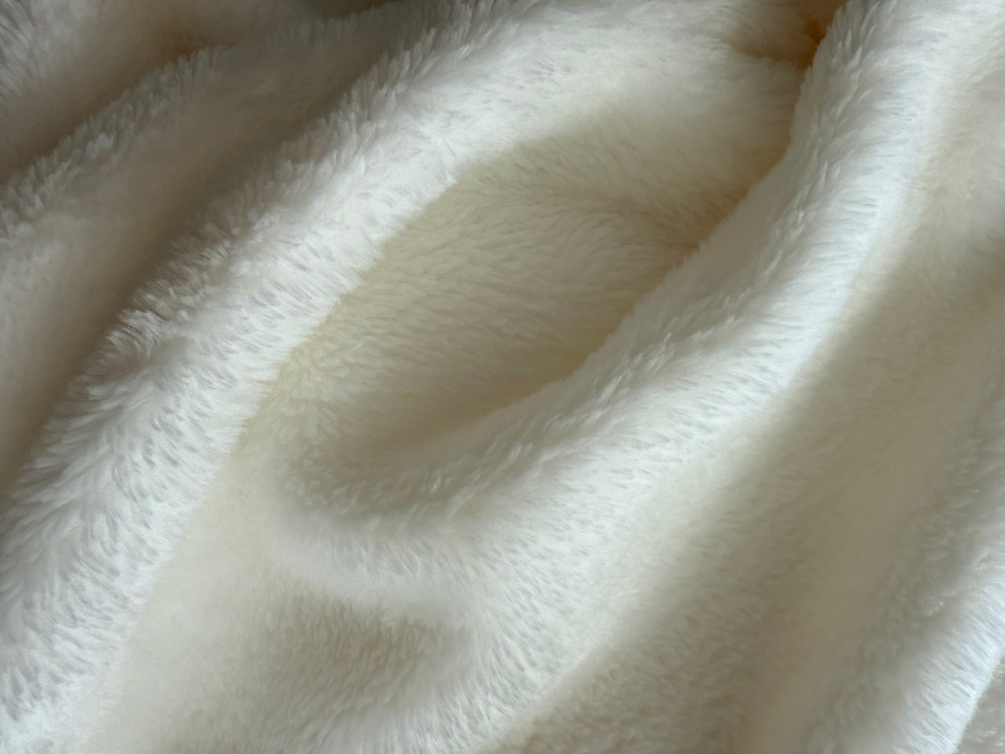 Close-up of the white fluffy fabric texture on the Baptism Blanket