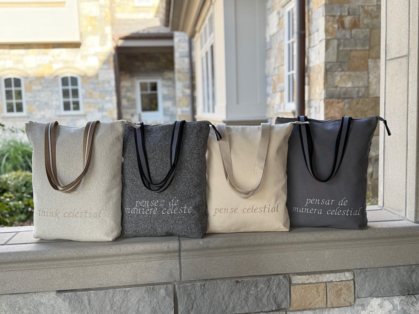 Four Classic Temple Bags on display with various colors, materials, and languages