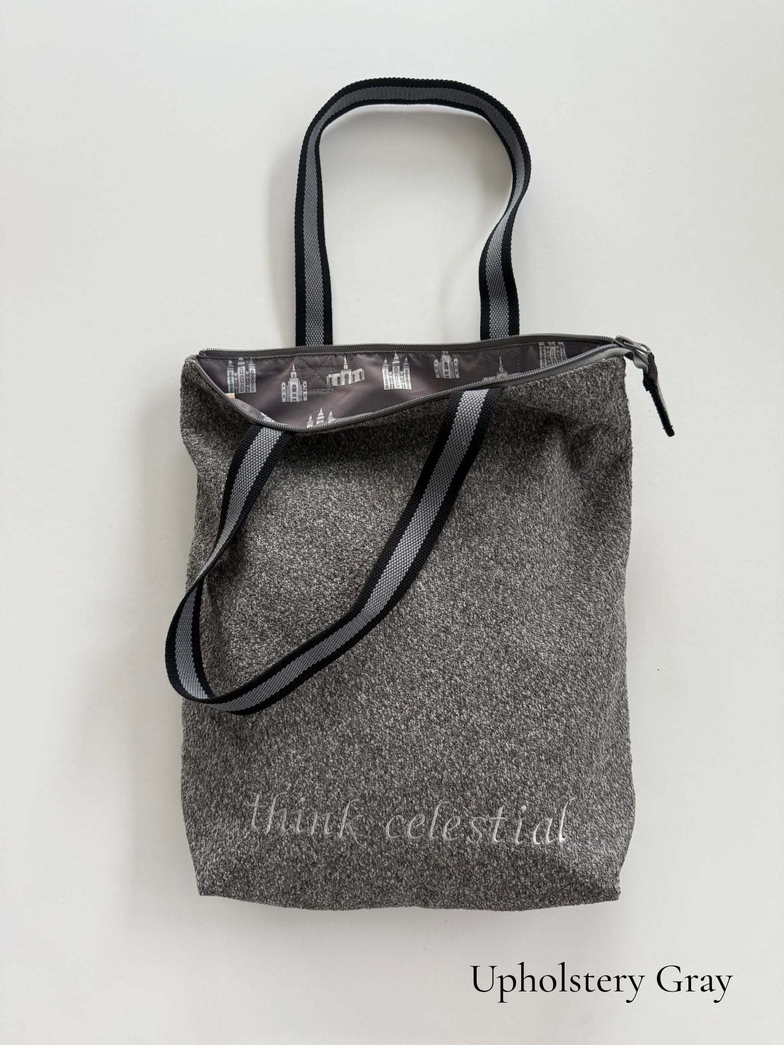 Upholstery Gray temple bag with gray and black striped strap and temples lining, embroidered with “think celestial”
