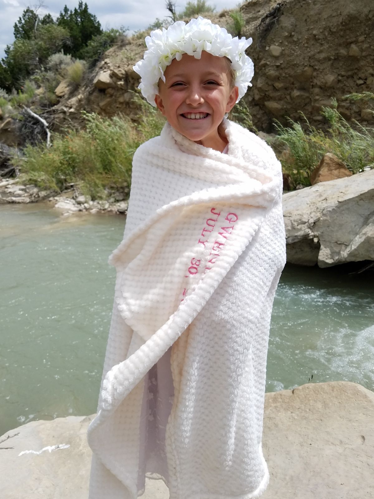 Girl with Baptism Blanket outside