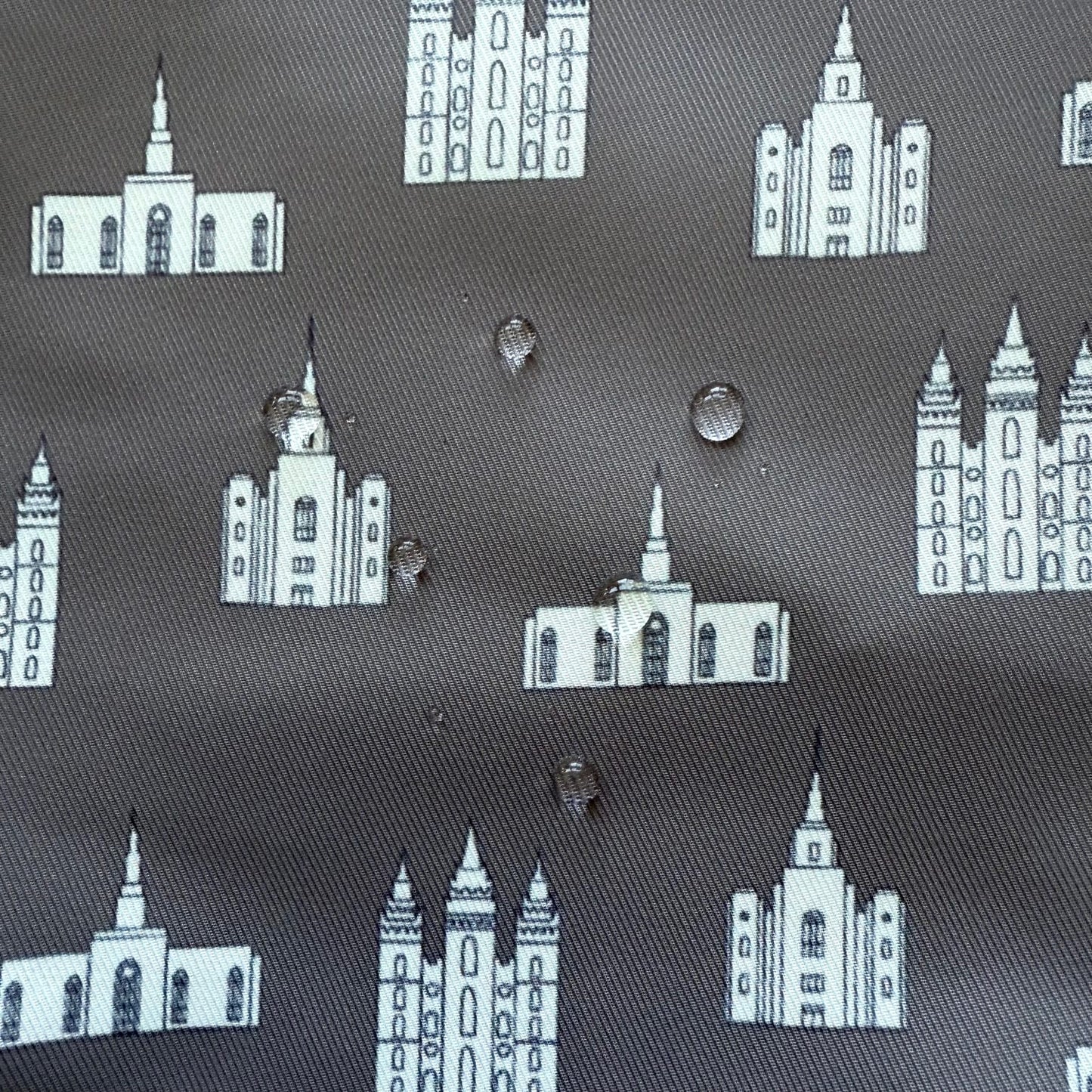 Close-up of temple print fabric showing water droplets on the surface to demonstrate water resistance