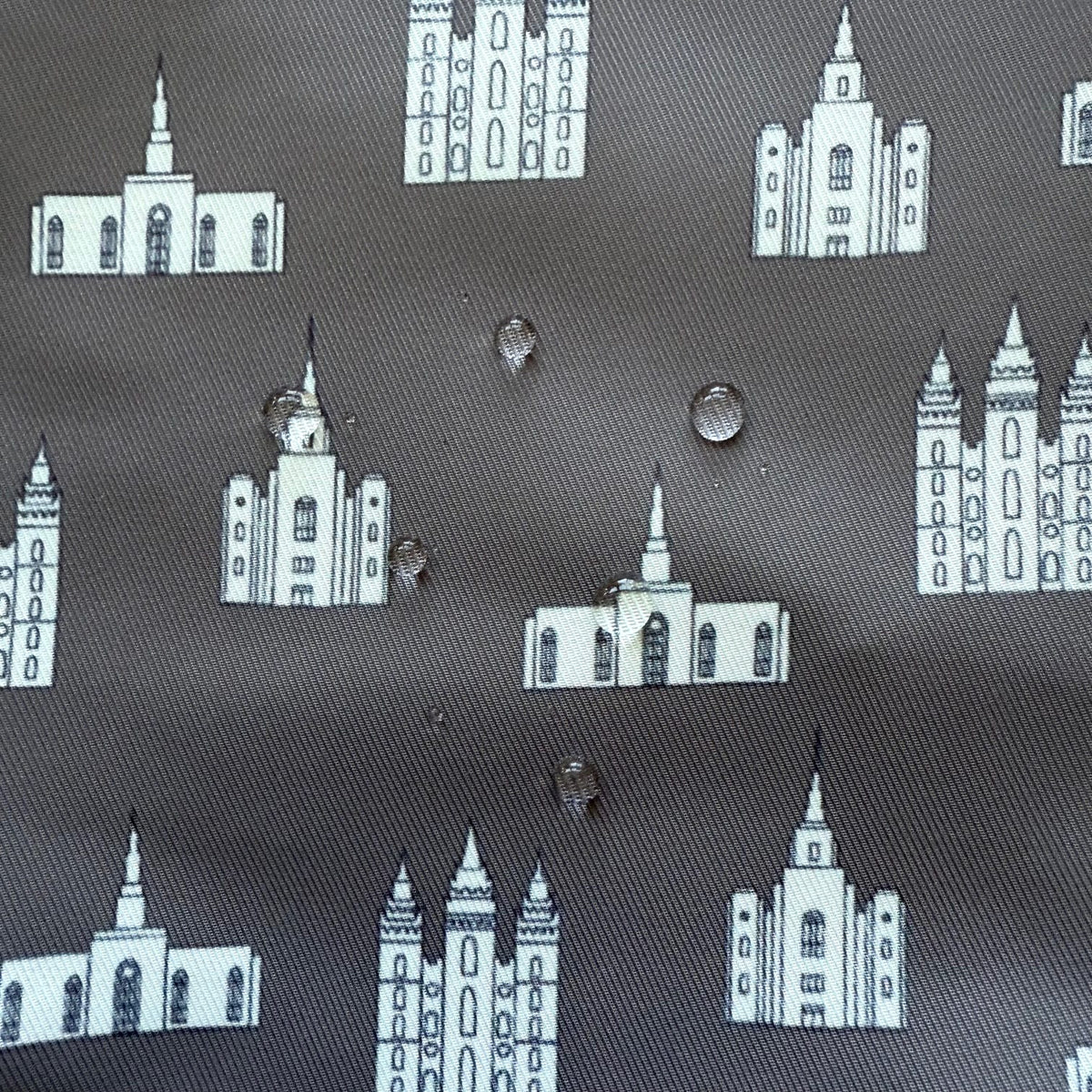 Close-up of temple print fabric showing water droplets on the surface to demonstrate water resistance