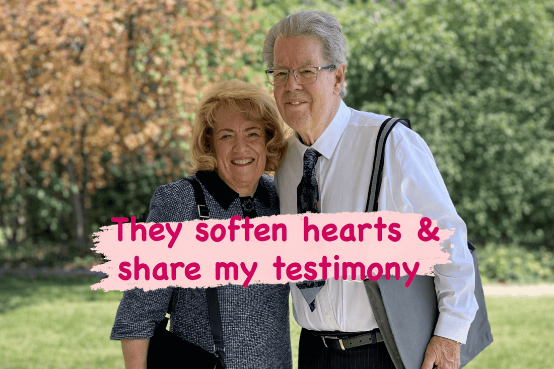 A man and woman standing together outside, smiling with a text overlay that reads 'They soften hearts & share my testimony'