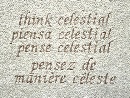 'Think Celestial' in various languages on a textured beige background