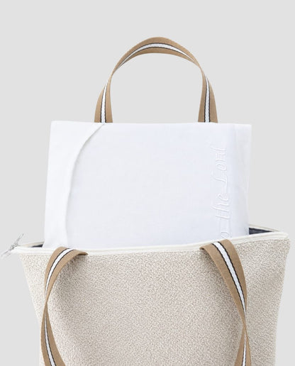 White temple envelope tucked inside a temple bag