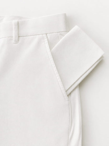 White cotton temple pouch tucked into front pocket of temple pants