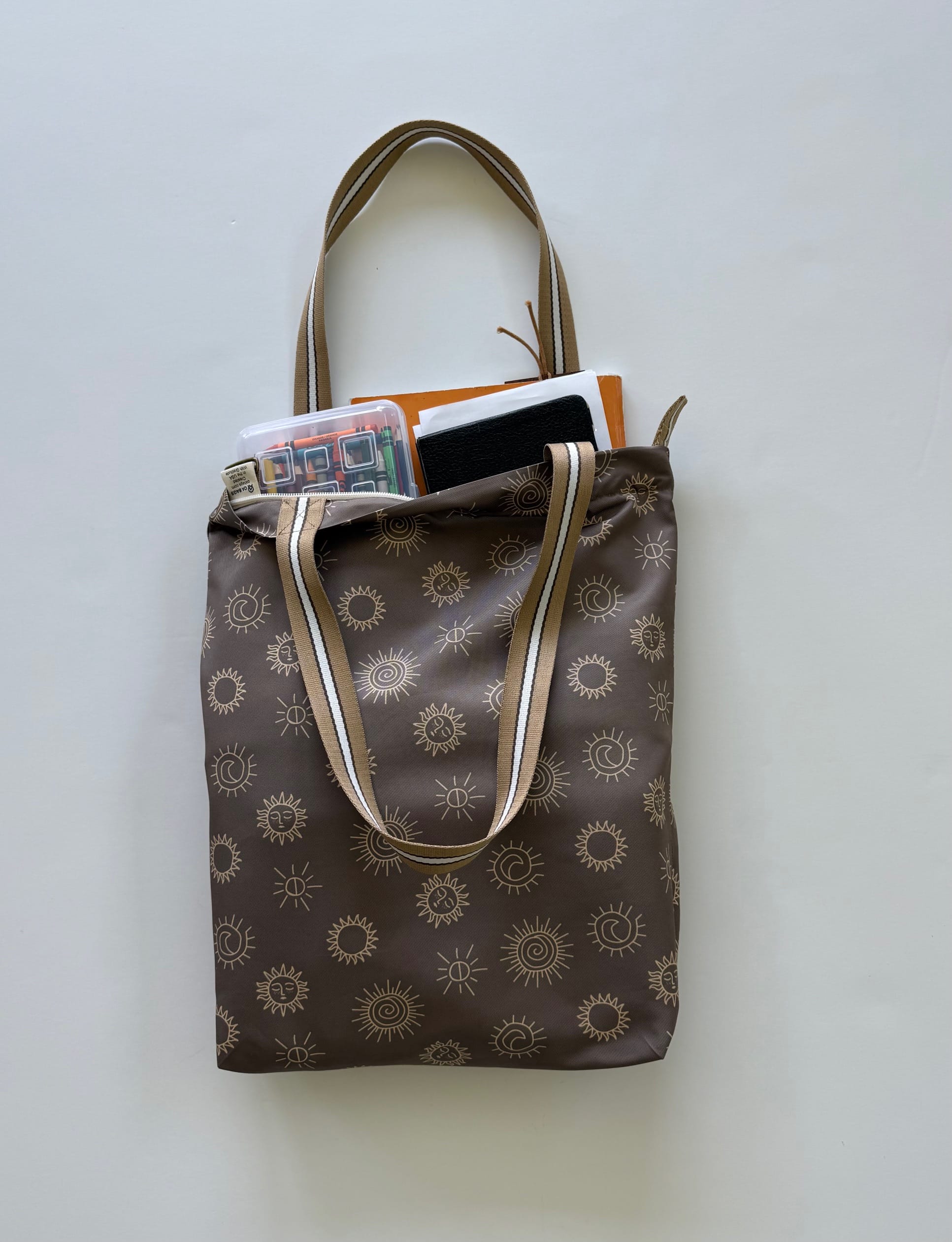 Temple Bag Church Tote with sunstones print and items inside