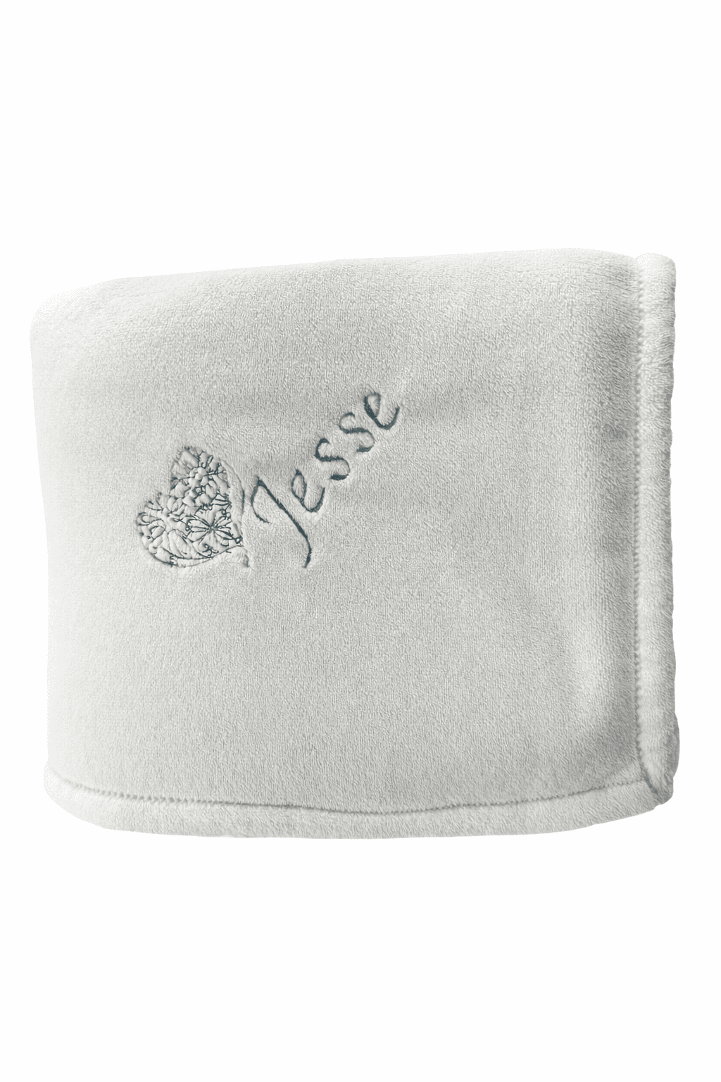 White faux fur blanket with the name 'Jesse' embroidered