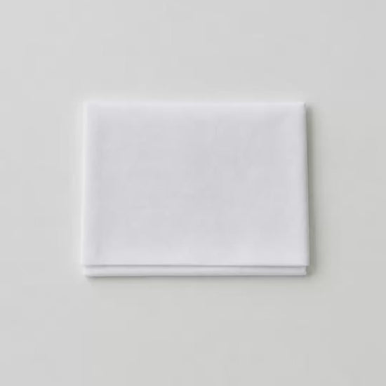 White folding temple card holder shown closed, open with cards inside, and tucked into a dress pocket